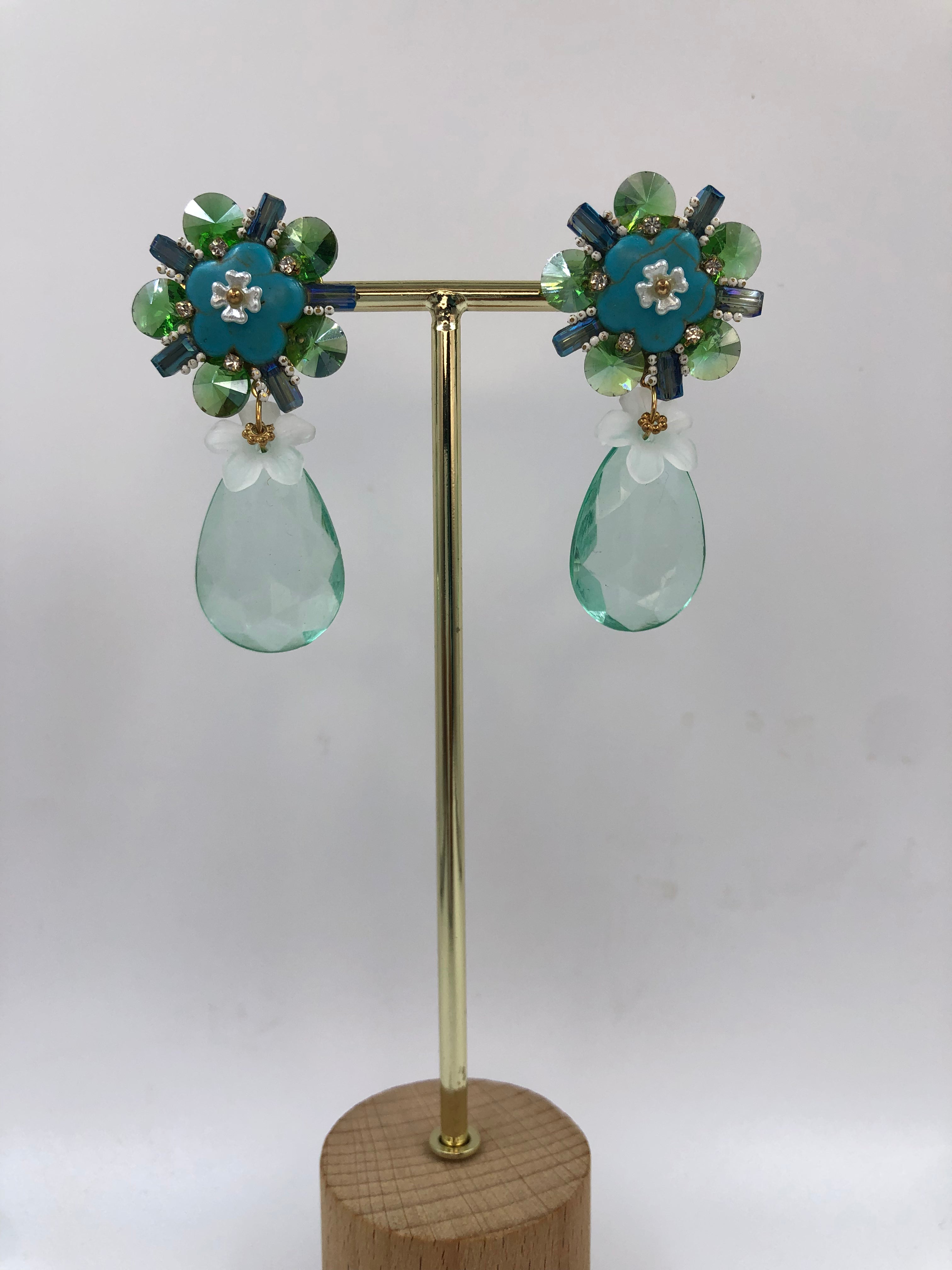 Floral Bloom with Green-Blue Crystal Dangles