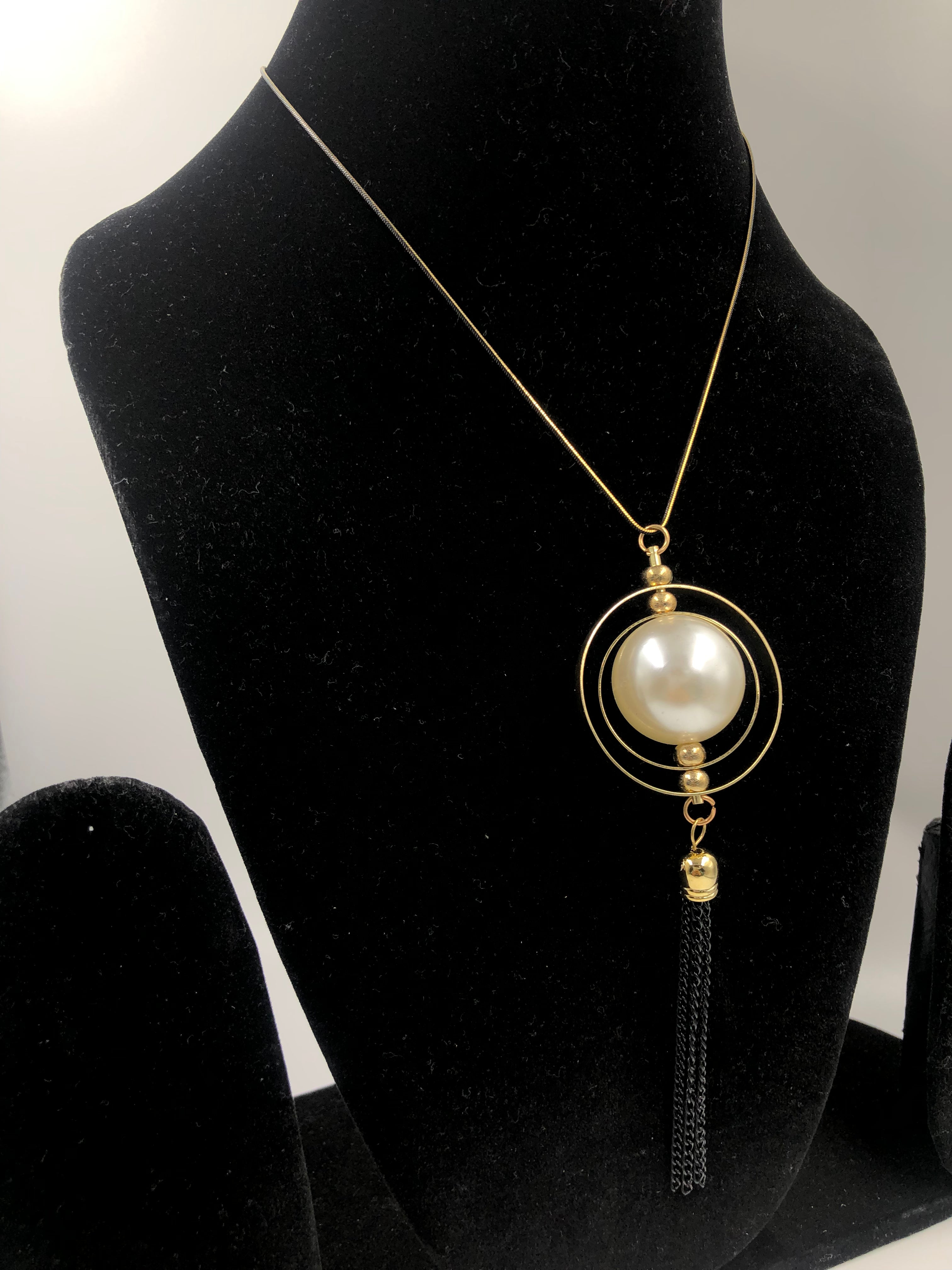 Timeless Circles: Concentric Design with Pearl Bead and Tassel