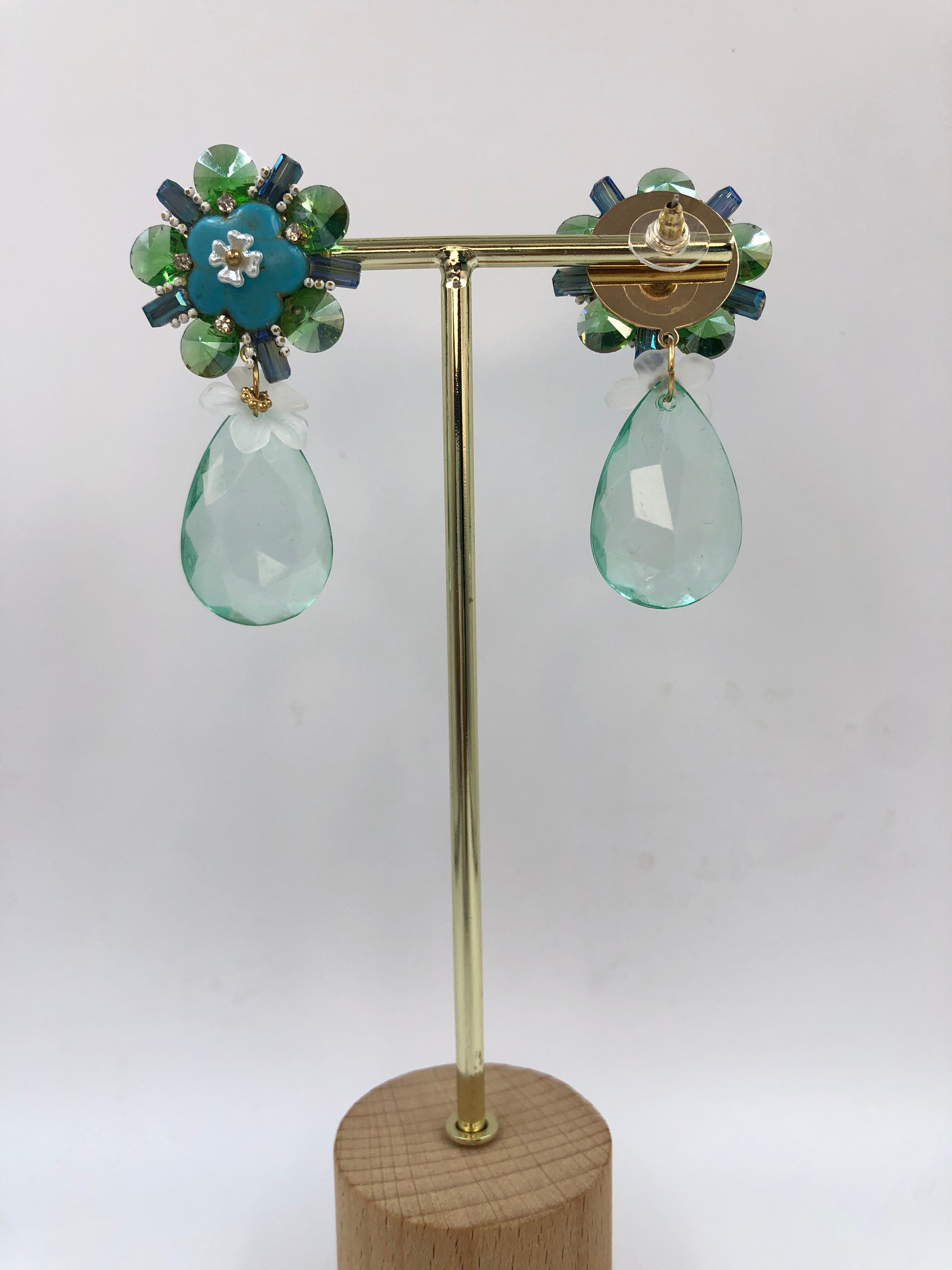 Floral Bloom with Green-Blue Crystal Dangles