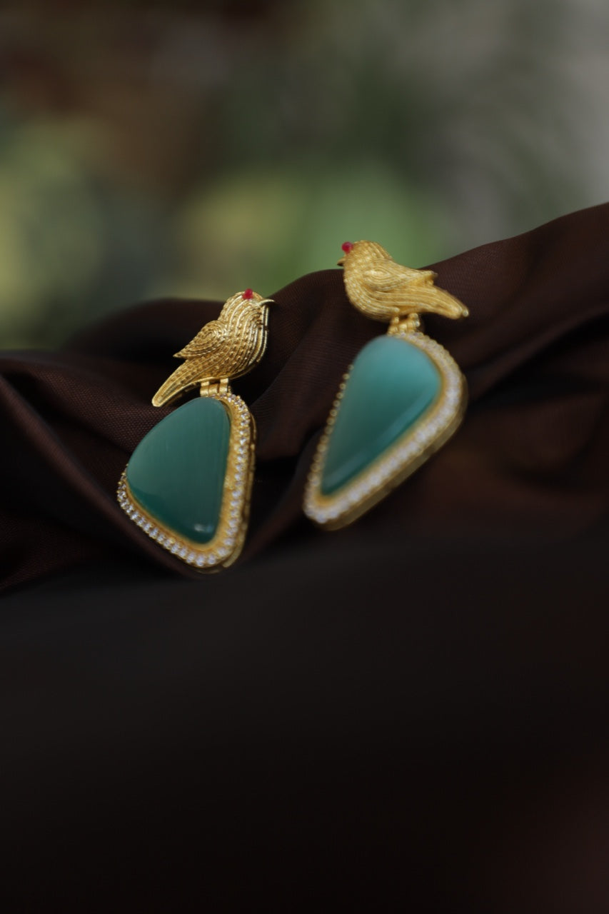 Golden Winged Perfection: Blue Stone Crystal Earrings