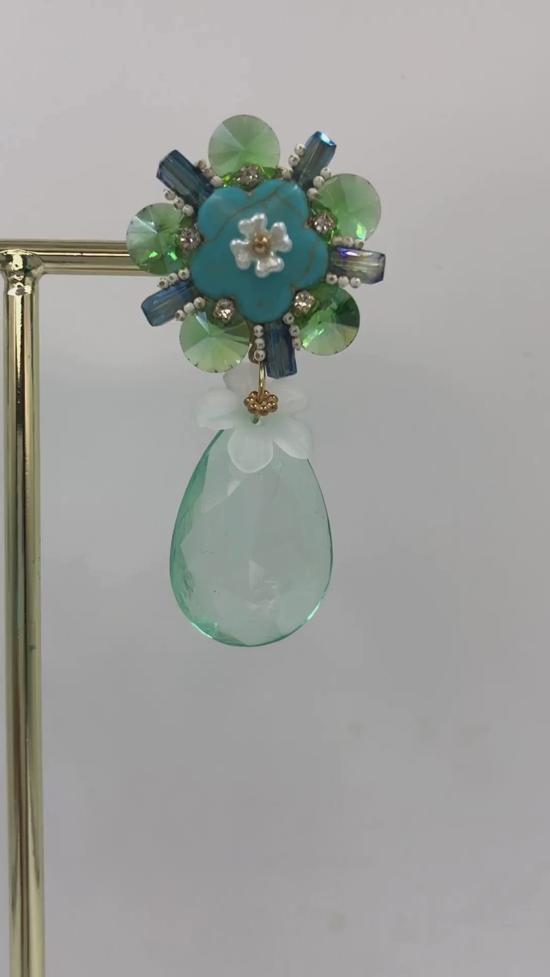 Floral Bloom with Green-Blue Crystal Dangles